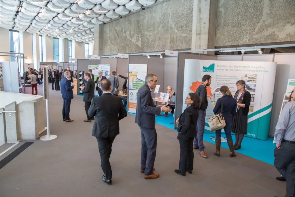 BIOKET event exhibition area with stands and attendees.